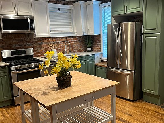 1st Floor: Kitchen with Upgraded Cabinets & Appliances