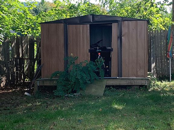 newer shed, fenced back yard