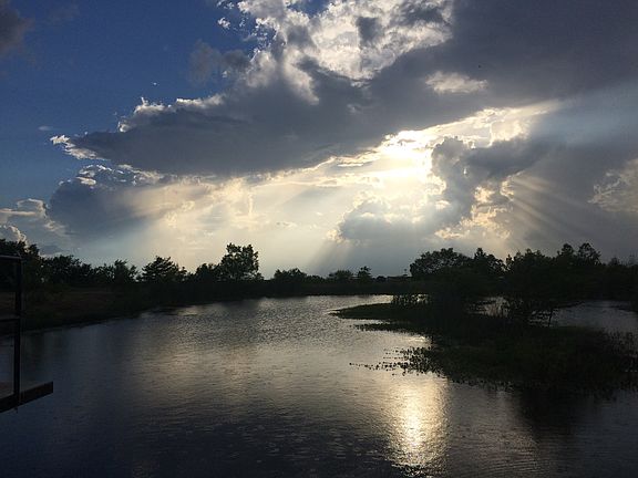 Sunset over stock pond.