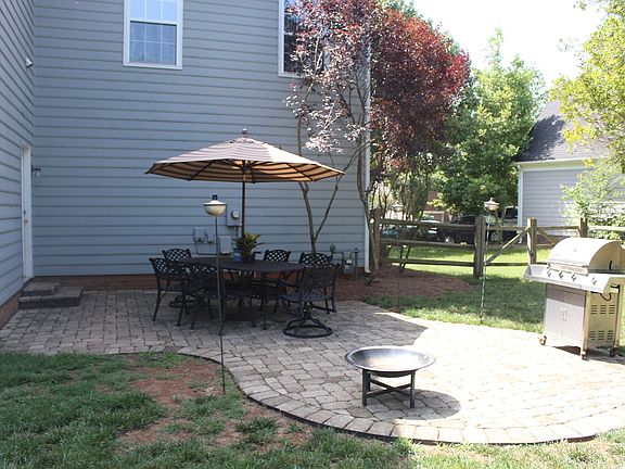 Fenced backyard, with patio