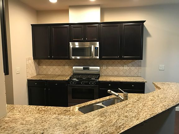 Kitchen with SS Appliances and Granite Countertops