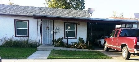 Front of House with Carport