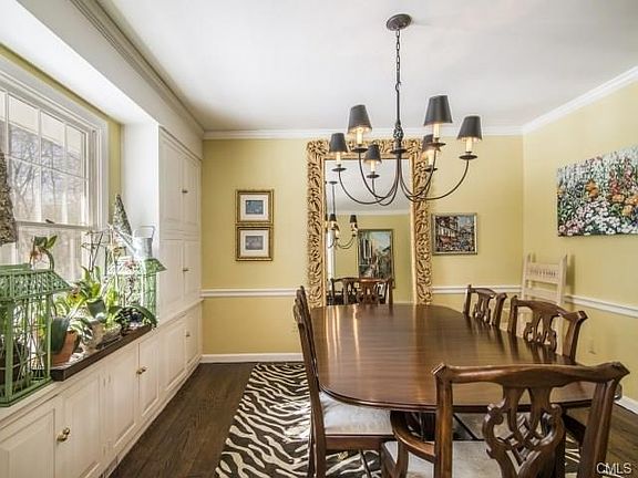 Formal Dining room has custom cabinetry built ins