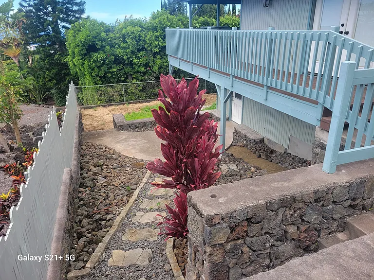 Sidewalk leading to back of property/bonus room.