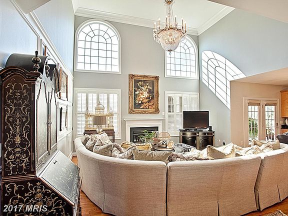 Dramatic 2 story family room with fireplace