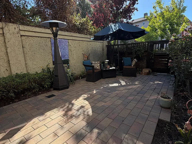 small patio backyard is private and has good sun exposure.