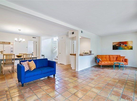 Large open living area focused to the view of the fronds and pond.