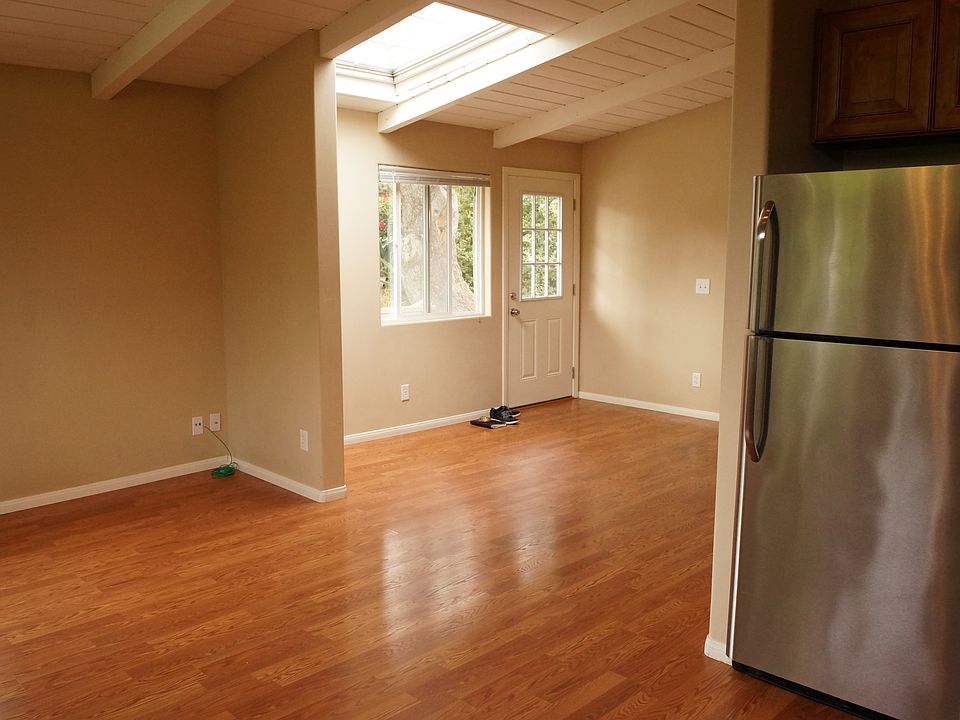 bright, open plan dining area with skylight