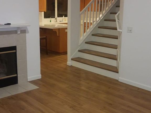 Living room and view of kitchen and stairs