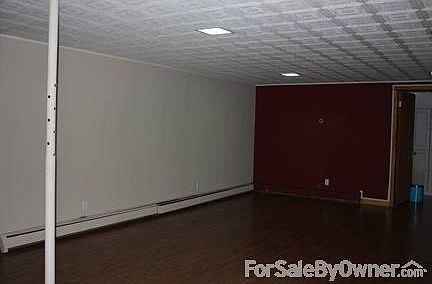 Downstairs Family Area
						:
						large room with hardwood floor, fire place