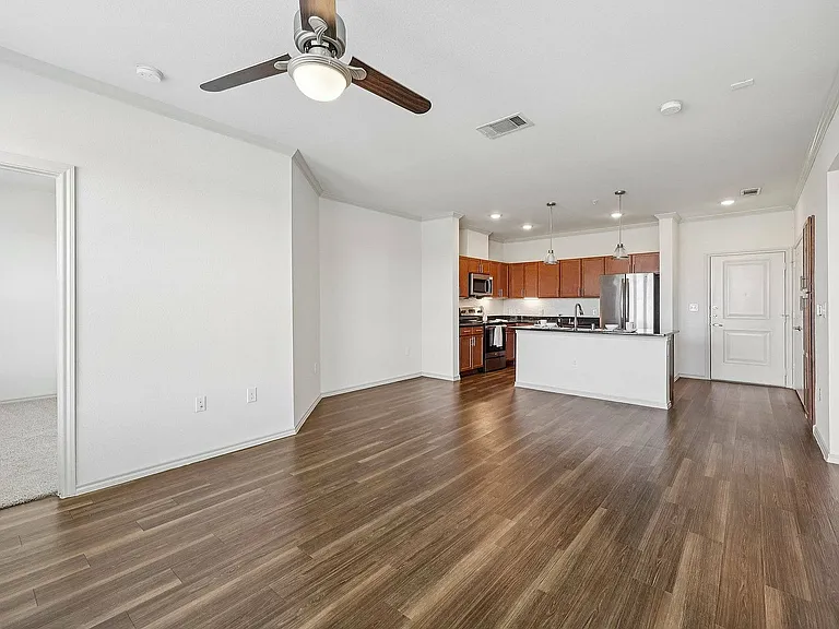 Open-concept living meets modern kitchen design at McDermott 55 with bright, airy layouts and stylish finishes.