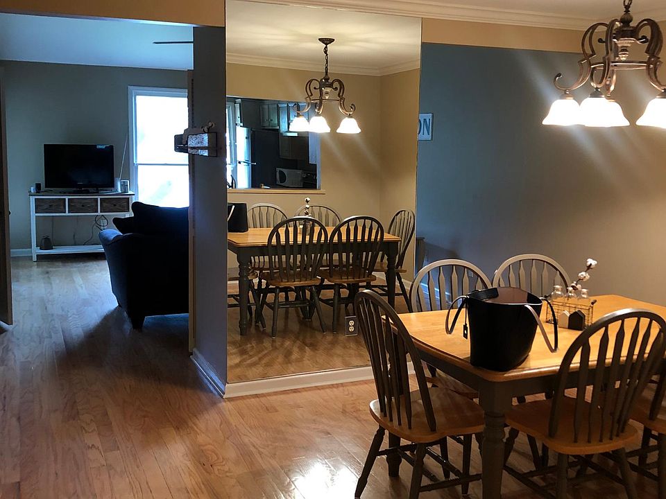 Open concept, large dining room & living space with hardwood floors