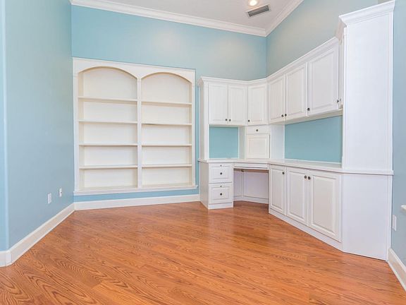 Office with Built In Desk and Shelves