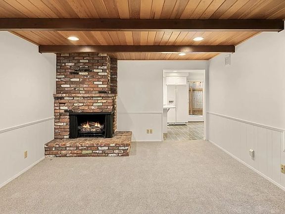 Flexible office area with large fireplace.