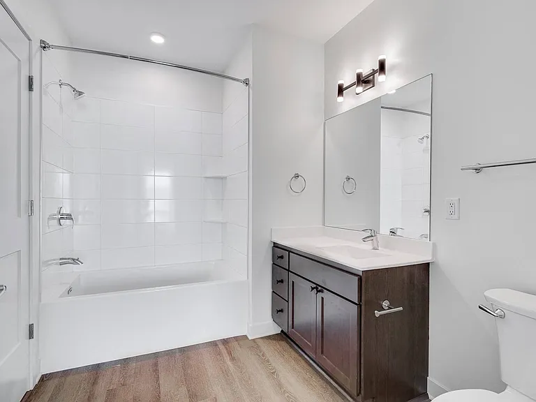 Modern bathrooms feature elegant finishes and plenty of storage.