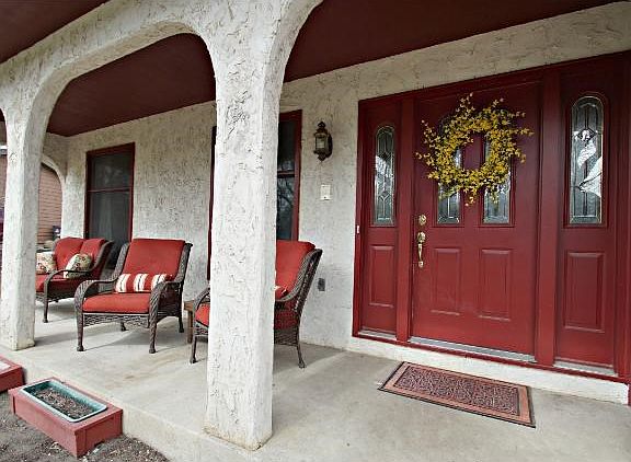 Lovely porch area in the front of the house to sit and enjoy those spring and summer evenings.