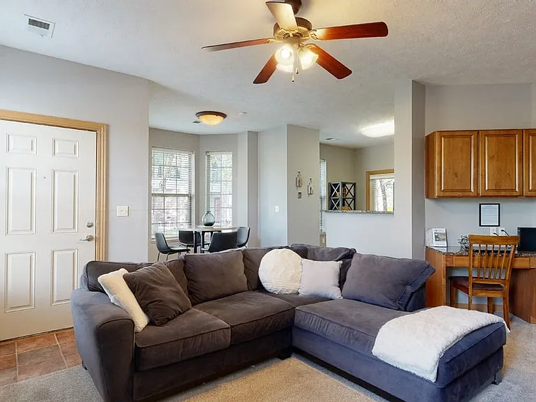Our inviting living rooms offer room for relaxation, complete with thoughtful design touches like built-in desks and cozy seating areas.
