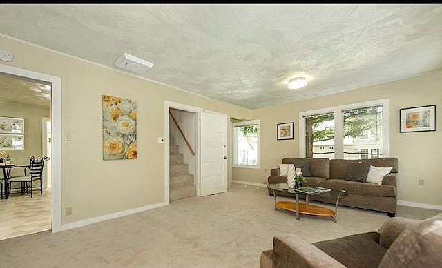 livingrooom with staris to go to the loft / bedroom