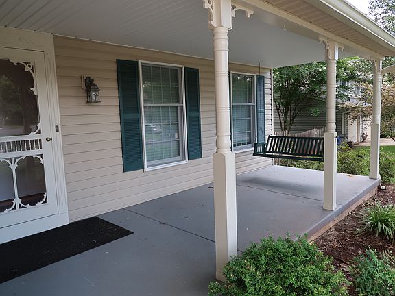 Welcoming and Relaxing front Porch with swing.