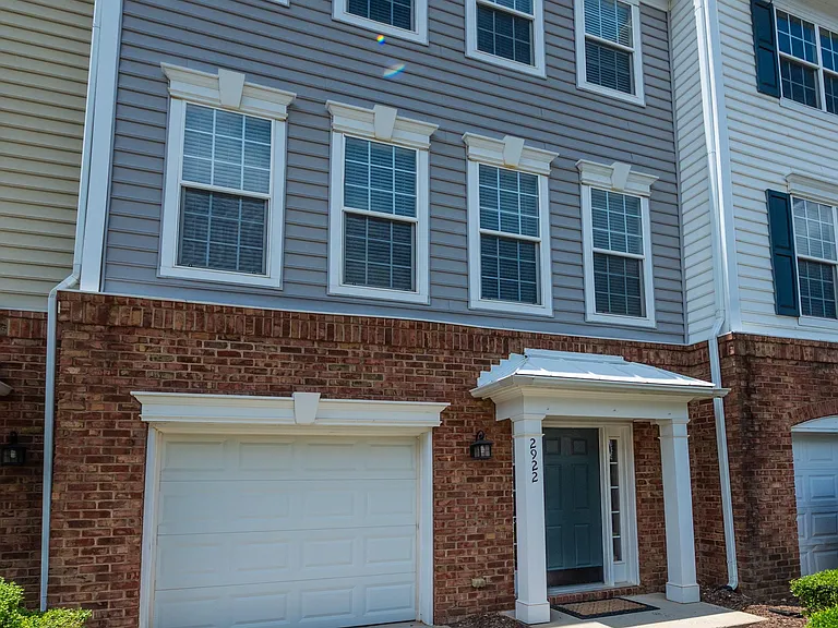 Front Entrance with attached garage and private driveway.