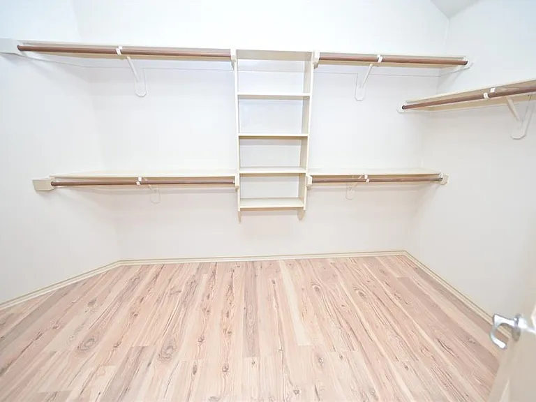 Large double racked walk-in closet