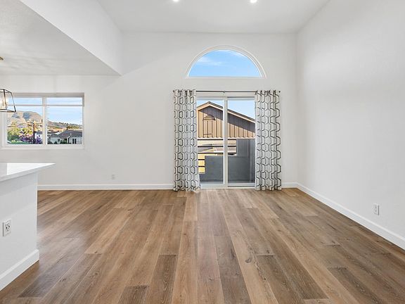 High ceiling and no one living above you. Great light and recessing cans on dimmers. Mountain views w/ lovely light at sunset