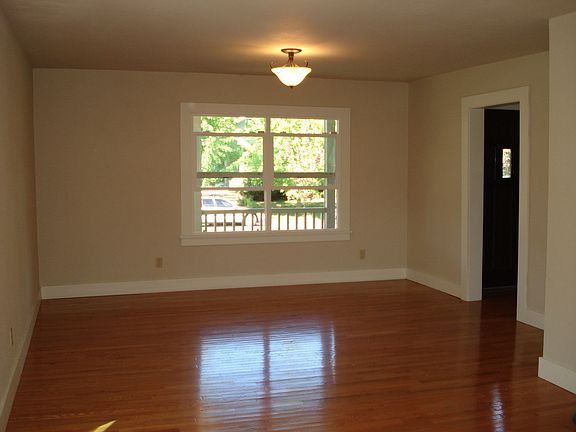 Living room overlooks the open front porch, perfect for relaxing