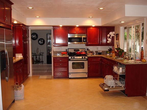 Huge gourmet kitchen with windows looking out into the back yard
