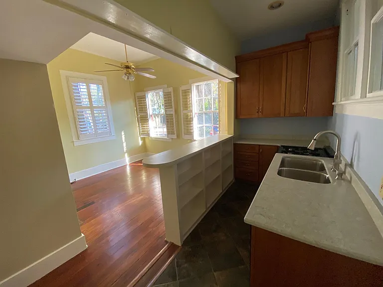 Wide angle shot reducing the size to show more of the apartment in the photo