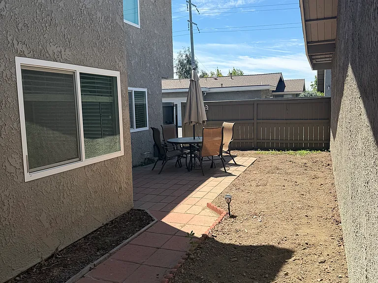 Private, gated patio area. Perfect for outdoor dining, lounging, and gardening.