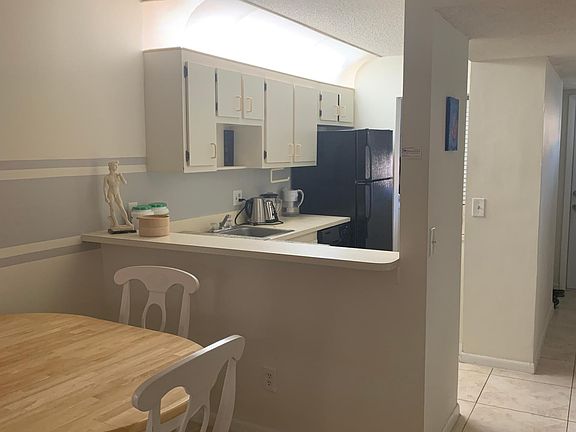 kitchen (2 stools at Breakfast Bar) and dining table (4 chairs, table is round but has extension & can seat 6 when oval.) Kitchen includes all basic utensils, microwave/range fan, convection & standard electric oven, glass top electric range, hot wat