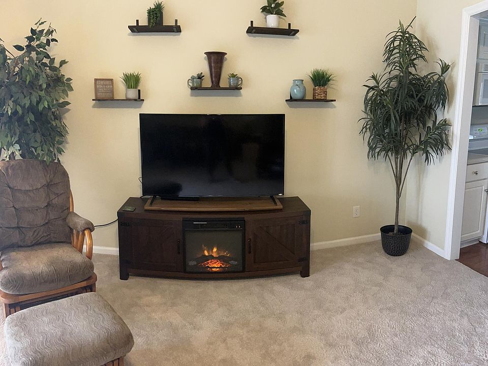 Living room with smart TV and electric fireplace
