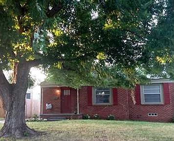 Exterior Front. Darling curb appeal with huge shade tree.