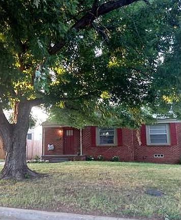 Exterior Front. Darling curb appeal with huge shade tree.