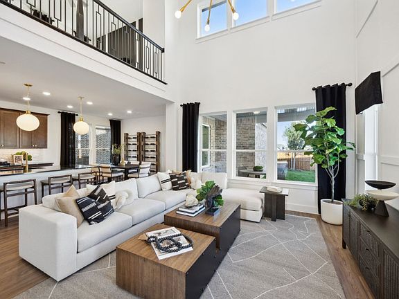 Spacious gathering room with two-story ceiling