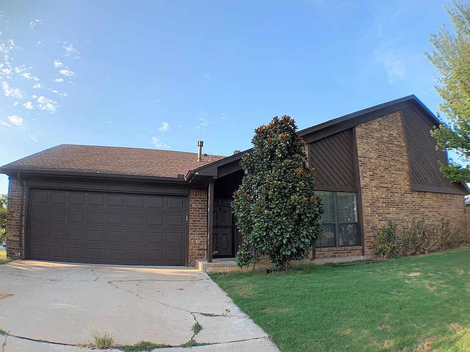 Two car garage. Nice size front yard with trees.
