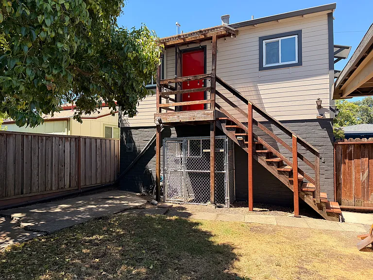 Front door and stairs with the catio under the stairs