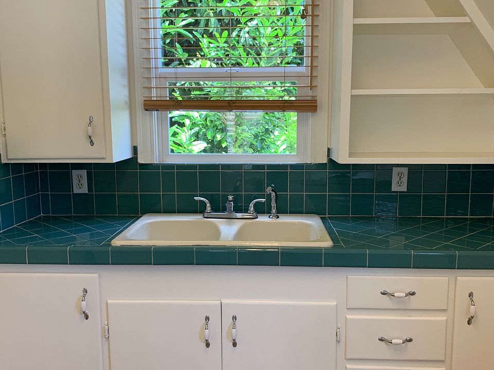 Kitchen sink, cupboards, shelves