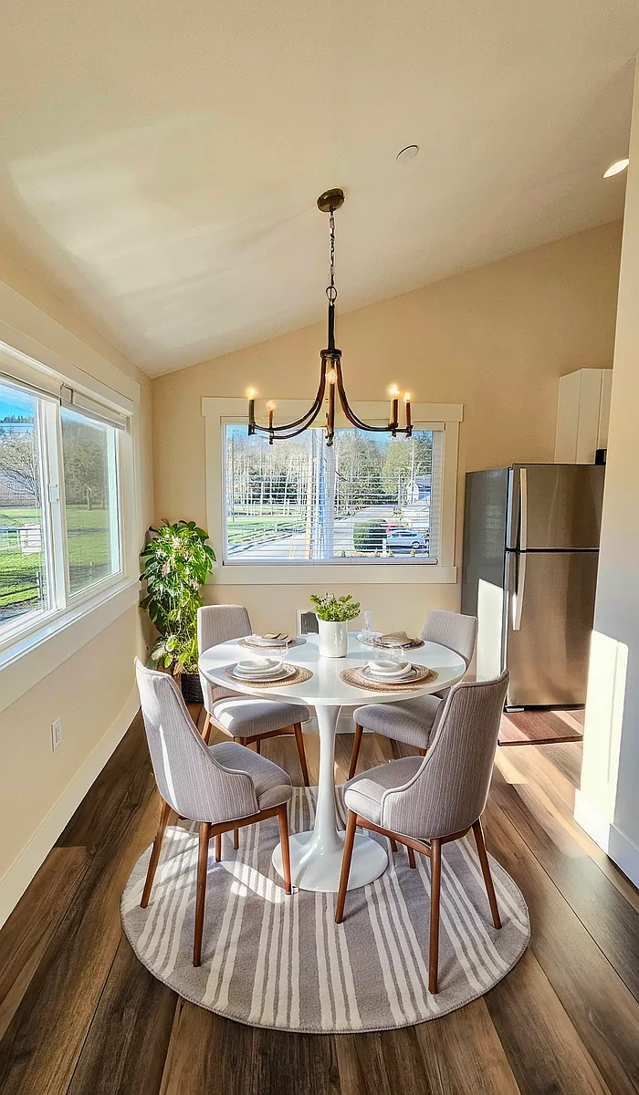 Dining room with stylish light fixture. - 705 Rainier Blvd N #3