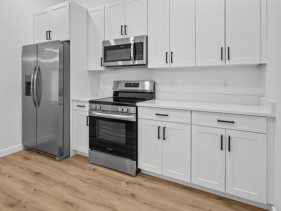 Updated kitchen with clean white cabinets
