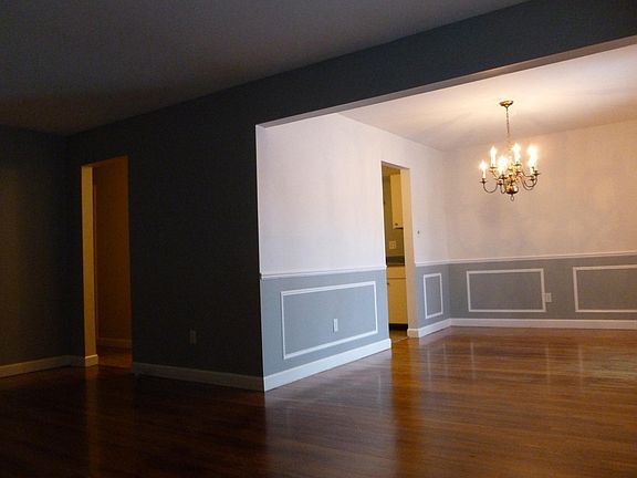 Living room with kitchen entrances view