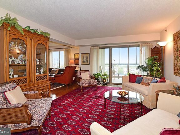 Living room opens to sun room with amazing views!