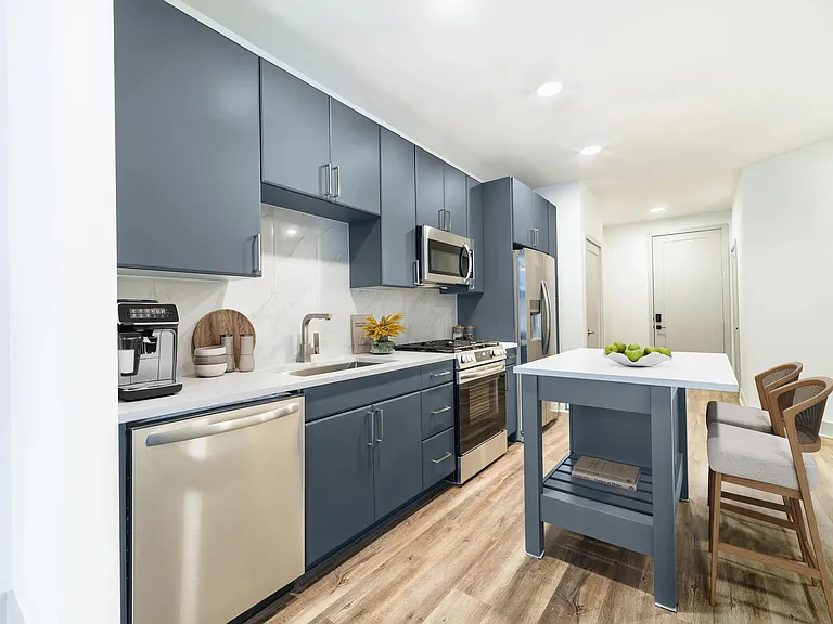 Contemporary kitchens at Modera Westside Trail offer a stylish island and sleek finishes, creating an inviting space for everyday living.