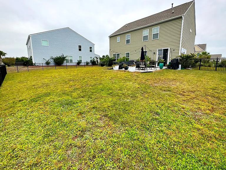 Massive fenced-in backyard with irrigation system