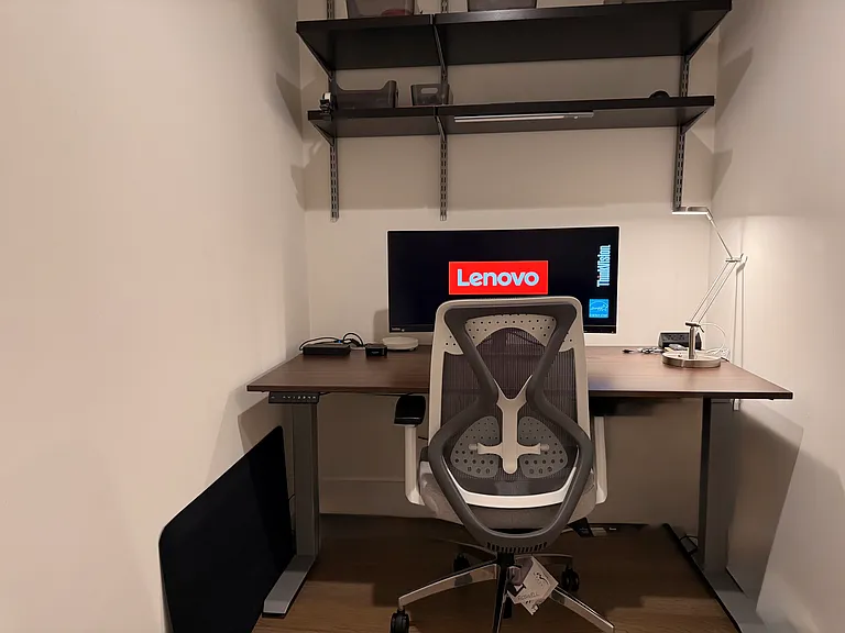 Office nook comes with everything you see there. Complete setup including docking station, lamp controlled by automation, and shelves for additional space.