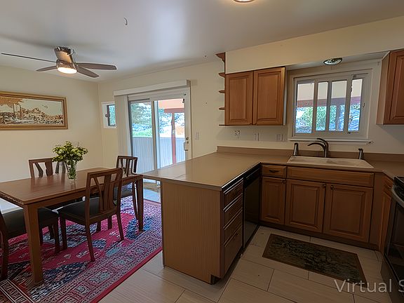 Combined kitchen and dining area, with recently updated cabinets and appliances.
