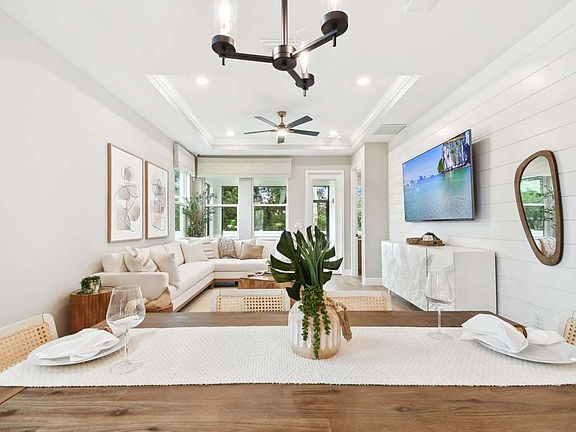 Sandpiper new construction luxury paired villa home plan cafe view to family room in 55 in Sun City