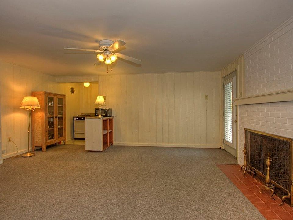 Living/Dining Room with Fireplace and Alcove Kitchen