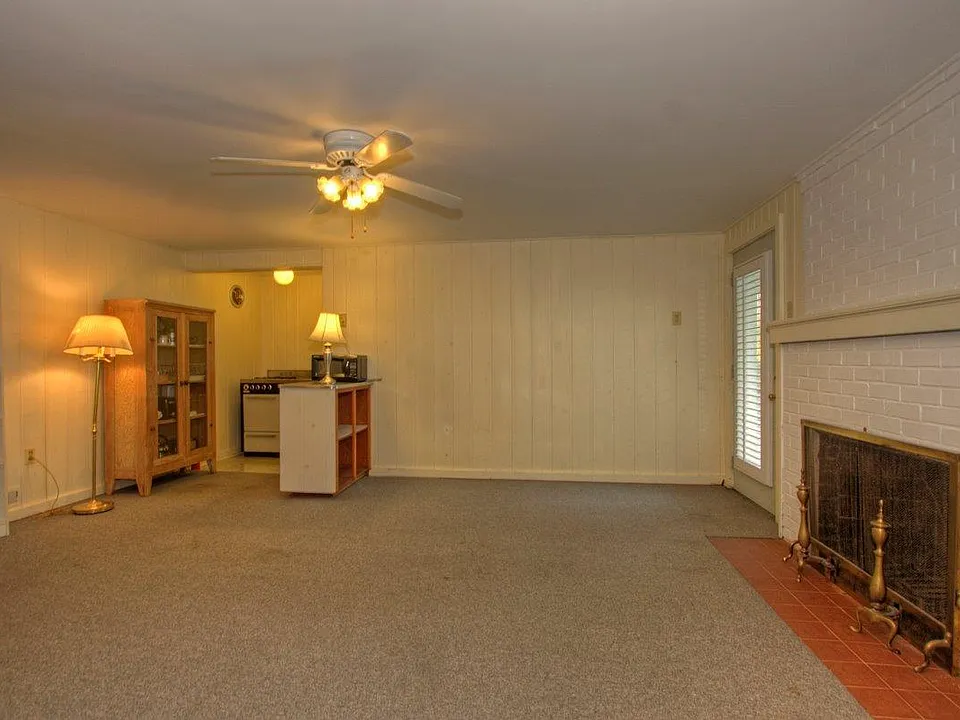 Living/Dining Room with Fireplace and Alcove Kitchen