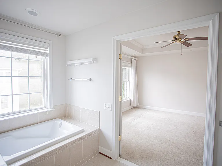 En suite bathroom elevates this master bedroom